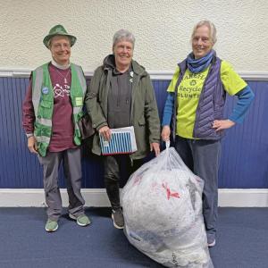 Hilary Greene, Jo-Ann Finn and Amanda Cobb with the collected bag of plastics. Photos by Kat Sheridan