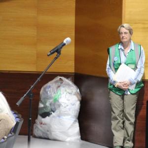 Hilary Greene with her bag of plastic bags, emphasizing over-usage. 
