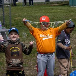 Myles Pfeiffer and Sterling Winters play with bubbles between games. 