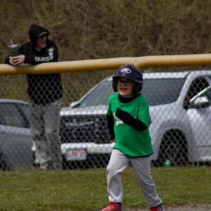 It's a hit! A teeball player books it to second. 