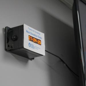 A sign shows the date of the vehicle's next drive. 