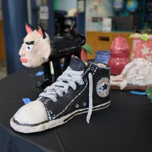 A sculpture of a converse shoe created by Ryan Dame