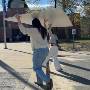Students carrying in the backing, donated by ScreenMobile SouthCoast.