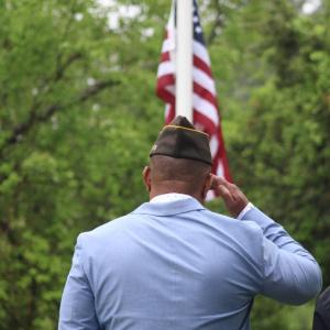 Onset VFW Post commander Benjamin Baptise salutes the flag.