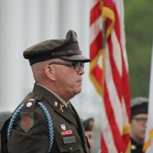 Matthew Stanton stands among flags.