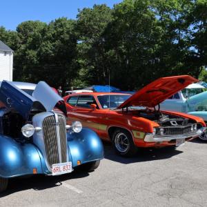 Cars with hoods open