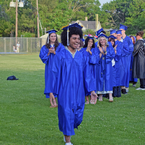 Isis Viera beams as he goes to get his diploma. 