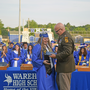 Ava Knight receives her diploma from Colonel Stanton. 