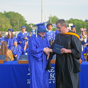 Matty Champa shakes Sean Brown's hand. 