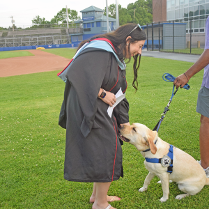 A staff member pets the Wareham Police comfort dog. 