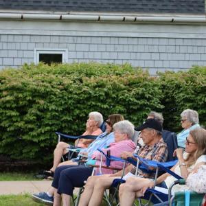 Concertgoers watch the performance. 