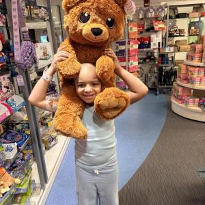 Mia purchases a gift for a friend who needed treatment at Boston’s Children’s Hospital. Photo source: Briana Lunetta