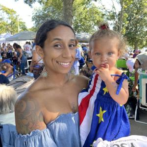 Rochelle Cardoza and her daughter, London, 1, in a dress with a Cape Verde flag pattern. Photo by Christian Uva