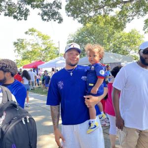 Mark Evora holds his son, Shilo, 1, who sports a Cape Verde soccer jersey. Photo by Christian Uva