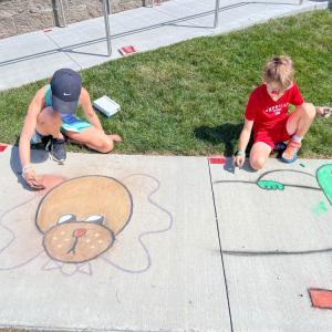 Cassidy Crompton, 10, drew a dog with a bowtie, while her brother, Chace, 8 drew a character from "Minions and Monsters." Photo by Christian Uva