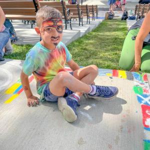 Tommy McGrath, 6, painted flags of all the countries in the World Cup, his favorite event of the summer. Photo by Christian Uva