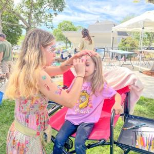 Addilynn McIntyre, 6, gets her face painted. Photo by Christian Uva