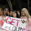 Junior Gianna Hernandez and senior McKenna Duggan with a friend and sign. Photos by Brandy Muz