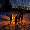 The group gathers around the fire. Photos by Brandy Muz