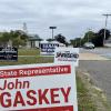 Signs for state representative candidates near Wareham Town Hall, one of the town's three polling locations. Photo by Christian Uva